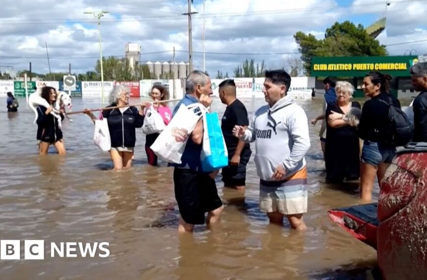 Residents flee homes in flooded Argentine city